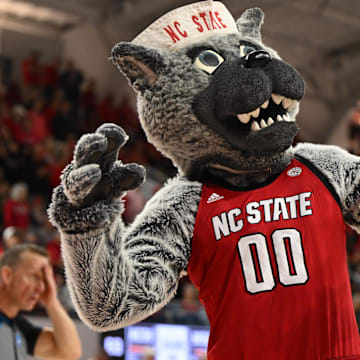 Mar 24, 2025; Raleigh, North Carolina, USA; The NC State Wolfpack mascot celebrates during the second half at James T. Valvano Arena at William Neal Reynolds. Mandatory Credit: William Howard-Imagn Images