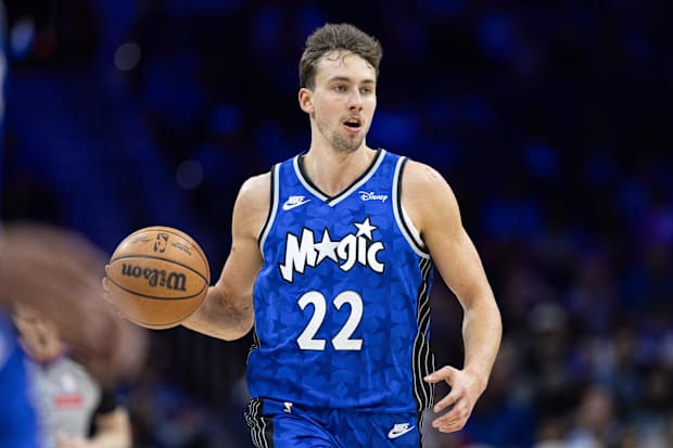 Orlando Magic forward Franz Wagner dribbles the ball in an NBA game versus the Philadelphia 76er