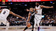 Feb 28, 2024; Denver, Colorado, USA; Sacramento Kings forward Keegan Murray (13) controls the ball against Denver Nuggets forward Justin Holiday (9) and forward Peyton Watson (8) in the fourth quarter at Ball Arena. Mandatory Credit: Isaiah J. Downing-Imagn Images