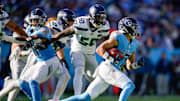 Tennessee Titans wide receiver Chimere Dike (17) returns a punt for a touchdown during the third quarter against the Seattle Seahawks at Nissan Stadium in Nashville, Tenn., Sunday, Nov. 23, 2025.
