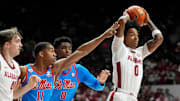Jan 14, 2025; Tuscaloosa, AL, USA; Alabama guard Labaron Philon (0) makes a pass as he is defended by Ole Miss guard Matthew Murrell (11) and Ole Miss forward Malik Dia (0) at Coleman Coliseum. Mandatory Credit: Gary Cosby Jr.-Tuscaloosa News