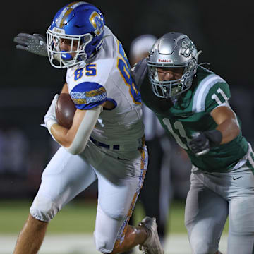 De La Salle linebacker Niko Baumgartner is about to wrap up Serra tight end Clay Hinsdale during the Spartans 39-10 win Friday night at Owen Owens Field on the campus of De La Salle.