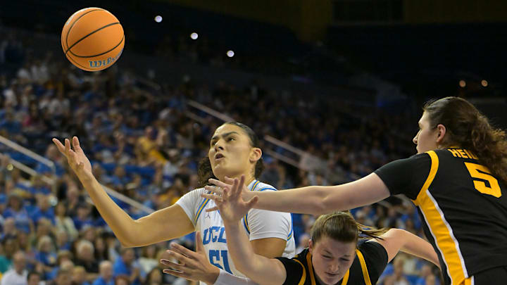 Feb 1, 2026; Los Angeles, California, USA;  UCLA Bruins center Lauren Betts (51) is defended by Iowa Hawkeyes guard Taylor Stremlow (1) and guard Ava Heiden (5) as she goes for a rebound in the first half at Pauley Pavilion presented by Wescom Financial. Mandatory Credit: Jayne Kamin-Oncea-Imagn Images