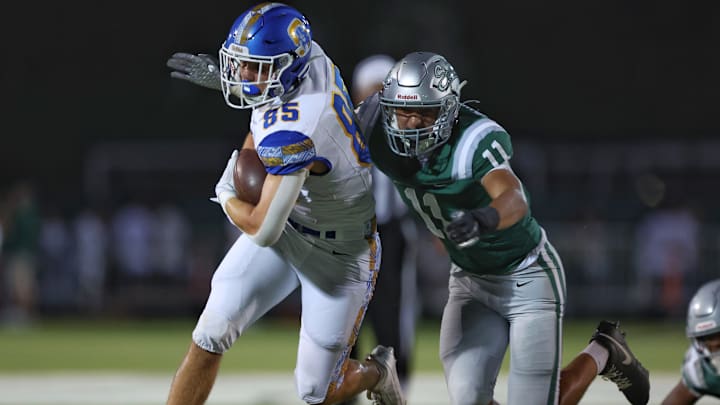 De La Salle linebacker Niko Baumgartner is about to wrap up Serra tight end Clay Hinsdale during the Spartans 39-10 win Friday night at Owen Owens Field on the campus of De La Salle.