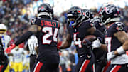 Jan 11, 2025; Houston, Texas, USA; Houston Texans corner back Kamari Lassiter (4) celebrates an intercaption during the second quarter against the Los Angeles Chargers in an AFC wild card game at NRG Stadium. Mandatory Credit: Troy Taormina-Imagn Images