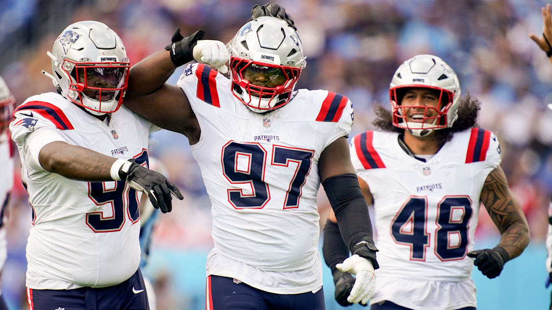New England Patriots defensive end Milton Williams (97) celebrates sacking Tennessee Titans quarterback Cam Ward (1) during the third quarter at Nissan Stadium in Nashville, Tenn., Sunday, Oct. 19, 2025.