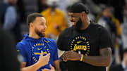 Dec 25, 2024; San Francisco, California, USA; Golden State Warriors guard Stephen Curry (left) and Los Angeles Lakers forward LeBron James (right) talk before the game at Chase Center. 