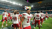 Oct 17, 2025; Miami Gardens, Florida, USA; Louisville Cardinals linebacker Jaxon Panariello (37) celebrates after winning the game against the Miami Hurricanes at Hard Rock Stadium. Mandatory Credit: Sam Navarro-Imagn Images