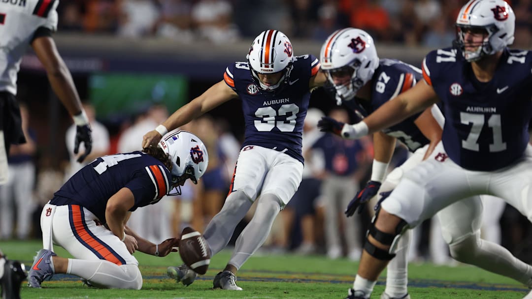 Sep 6, 2025; Auburn, Alabama, USA;  Auburn Tigers place kicker Towns McGough (33) attempts a field goal during the second quarter against the Ball State Cardinals at Jordan-Hare Stadium. Mandatory Credit: John Reed-Imagn Images