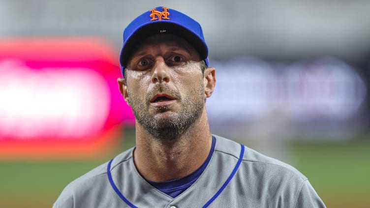 Mar 30, 2023; Miami, Florida, USA; New York Mets starting pitcher Max Scherzer (21) returns to the