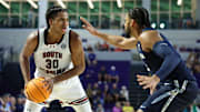 Nov 25, 2024; Fort Myers, Florida, USA; South Carolina Gamecocks forward Collin Murray-Boyles (30) is guarded by Xavier Musketeers forward Jerome Hunter (2) in the second half  at Suncoast Credit Union Arena. Mandatory Credit: Nathan Ray Seebeck-Imagn Images