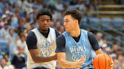 Oct 4, 2025; Charlotte, NC, USA; North Carolina Tar Heels guard Luka Bogavac (44) with the ball as guard Jaydon Young (4) defends in the second half at Dean E. Smith Center. Mandatory Credit: Bob Donnan-Imagn Images