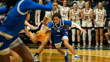Buffalo's Noelani Cornfield (4) reaches for the ball as the University of Southern Indiana Screaming Eagles play the University of Buffalo Bulls during the WNIT Super 16 at Liberty Arena in Evansville, Ind., Thursday, March 27, 2025.