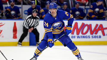 Feb 2, 2025; Buffalo, New York, USA;  Buffalo Sabres center Dylan Cozens (24) looks to make a pass during the second period against the New Jersey Devils at KeyBank Center. Mandatory Credit: Timothy T. Ludwig-Imagn Images