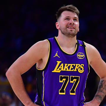 Feb 25, 2025; Los Angeles, California, USA; Los Angeles Lakers guard Luka Doncic (77) reacts against the Dallas Mavericks during the first quarter at Crypto.com Arena. Mandatory Credit: Gary A. Vasquez-Imagn Images