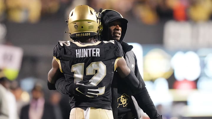 Colorado Buffaloes wide receiver Travis Hunter is congratulated for his touchdown by head coach Deion Sanders 