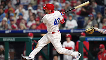 Apr 15, 2025; Philadelphia, Pennsylvania, USA; Philadelphia Phillies designated hitter Kyle Schwarber (12) hits a single against the San Francisco Giants in the sixth inning at Citizens Bank Park. All players wore #42 for Jackie Robinson Day. 