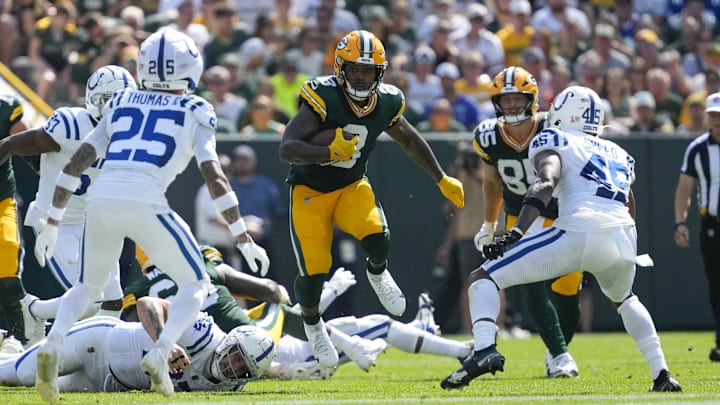 Sep 15, 2024; Green Bay, Wisconsin, USA;  Green Bay Packers running back Josh Jacobs (8) rushes with the football during the second quarter against the Indianapolis Colts at Lambeau Field. Mandatory Credit: Jeff Hanisch-Imagn Images