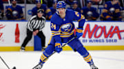 Feb 2, 2025; Buffalo, New York, USA;  Buffalo Sabres center Dylan Cozens (24) looks to make a pass during the second period against the New Jersey Devils at KeyBank Center. Mandatory Credit: Timothy T. Ludwig-Imagn Images