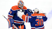 Jun 4, 2025; Edmonton, Alberta, CAN; Edmonton Oilers goaltender Stuart Skinner (74) reacts with goaltender Calvin Pickard (30) after defeating the Florida Panthers in overtime for game one of the 2025 Stanley Cup Final at Rogers Place. Mandatory Credit: Walter Tychnowicz-Imagn Images