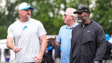 Detroit Lions head coach Dan Campbell, left, talks to team president and CEO Rod Wood and general manager Brad Holmes after practice during training camp at Meijer Performance Center in Allen Park on Sunday, July 20, 2025.