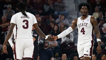 Mar 4, 2025; Starkville, Mississippi, USA; Mississippi State Bulldogs forward Cameron Matthews (4) reacts with forward KeShawn Murphy (3) during the first half against the Texas Longhorns at Humphrey Coliseum. Mandatory Credit: Petre Thomas-Imagn Images