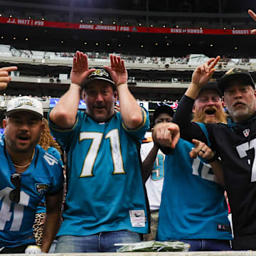 Nov 9, 2025; Houston, Texas, USA; Jacksonville Jaguars fans cheer against the Houston Texans in the first half  at NRG Stadium. Mandatory Credit: Thomas Shea-Imagn Images