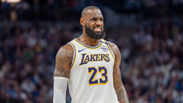 Apr 27, 2025; Minneapolis, Minnesota, USA; Los Angeles Lakers forward LeBron James (23) talks with a referee in the third quarter against the Minnesota Timberwolves during game four of first round for the 2025 NBA Playoffs at Target Center. Mandatory Credit: Matt Blewett-Imagn Images