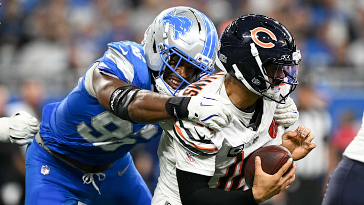 Detroit Lions linebacker Al-Quadin Muhammad sacks Chicago Bears quarterback Caleb Williams