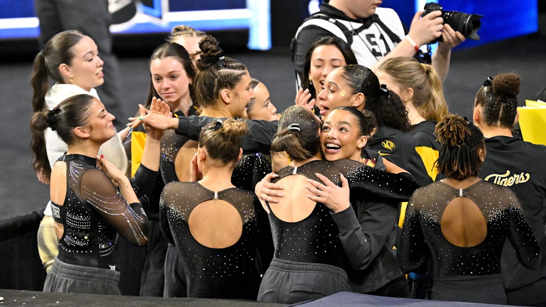 Apr 17, 2025; Fort Worth, TX, USA; The University of Missouri Tiger team celebrate after the announcement of the final team scores during the 2025 Women's National Gymnastics Semifinal at Dickies Arena. Mandatory Credit: Jerome Miron-Imagn Images