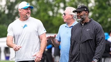 Detroit Lions head coach Dan Campbell, left, talks to team president and CEO Rod Wood and general manager Brad Holmes after practice during training camp at Meijer Performance Center in Allen Park on Sunday, July 20, 2025.