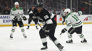 Dec 4, 2024; Los Angeles, California, USA; Los Angeles Kings right wing Quinton Byfield (55) reaches for the puck against the Dallas Stars during the second period of a hockey game at Crypto.com Arena. Mandatory Credit: Jessica Alcheh-Imagn Images