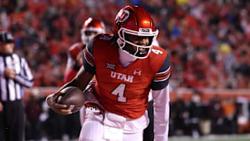 Oct 11, 2025; Salt Lake City, Utah, USA; Utah Utes quarterback Devon Dampier (4) scores a touchdown against the Arizona State Sun Devils during the third quarter at Rice-Eccles Stadium. Mandatory Credit: Rob Gray-Imagn Images