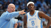 Dec 7, 2025; Chapel Hill, North Carolina, USA;  North Carolina Tar Heels assistant coach Pat Sullivan with forward Caleb Wilson (8) in the second half at Dean E. Smith Center. Mandatory Credit: Bob Donnan-Imagn Images