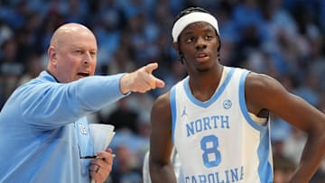 Dec 7, 2025; Chapel Hill, North Carolina, USA;  North Carolina Tar Heels assistant coach Pat Sullivan with forward Caleb Wilson (8) in the second half at Dean E. Smith Center. Mandatory Credit: Bob Donnan-Imagn Images