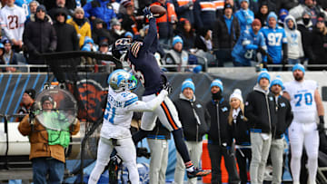 Chicago Bears wide receiver Rome Odunze (15) makes a catch over Detroit Lions cornerback Amik Robertson (21)