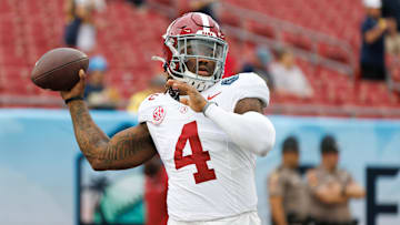 Dec 31, 2024; Tampa, FL, USA; Alabama Crimson Tide quarterback Jalen Milroe (4) throws the ball before a game against the Michigan Wolverines at Raymond James Stadium. Mandatory Credit: Matt Pendleton-Imagn Images