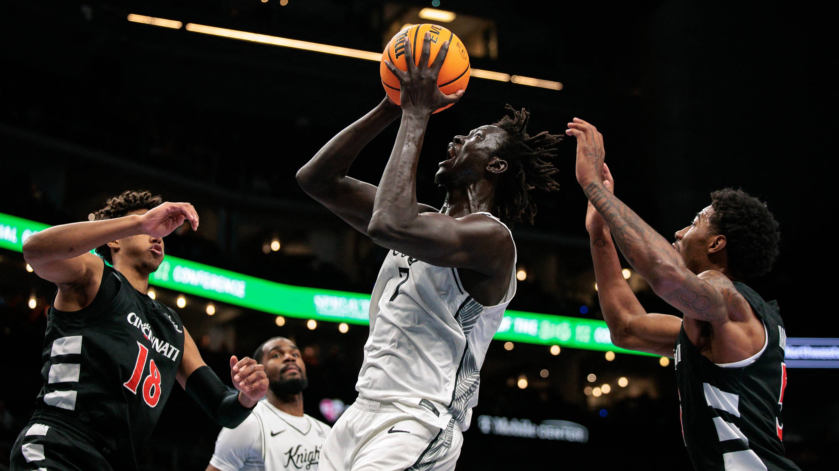 Mar 11, 2026; Kansas City, MO, USA; UCF Knights center John Bol (7) shoots the ball during the first half against the Cincinnati Bearcats at T-Mobile Center. Mandatory Credit: William Purnell-Imagn Images | IMAGN IMAGES via Reuters Connect