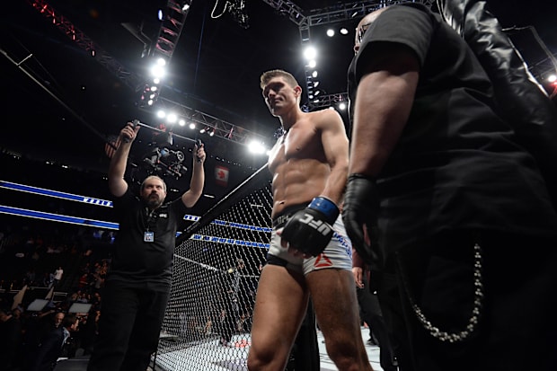 Stephen Thompson leaves the Octagon after his welterweight championship bout against Tyron Woodley at UFC 209.