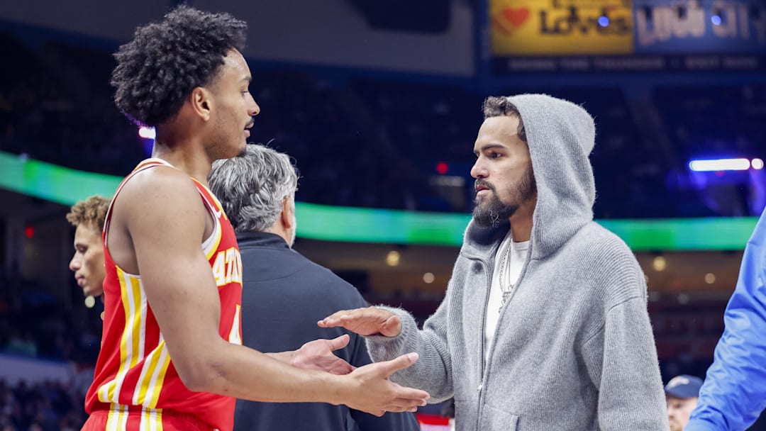 Oct 17, 2024; Oklahoma City, Oklahoma, USA; Atlanta Hawks guard Kobe Bufkin (4) and guard Trae Young (11)  high five during a time out against the Oklahoma City Thunder during the second half at Paycom Center. Mandatory Credit: Alonzo Adams-Imagn Images