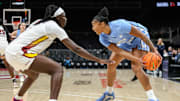 Oct 30, 2025; Atlanta, GA, USA; North Carolina Tar Heels forward Nyla Harris (2) protects the ball against South Carolina Gamecocks center Madina Okot (11) during the first quarter at State Farm Arena. 