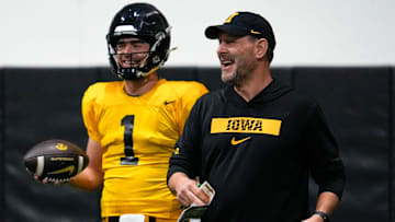 Iowa quarterback Brendan Sullivan (1) and offensive coordinator Tim Lester are pictured during practice Thursday, April 3, 2025 in Iowa City, Iowa.