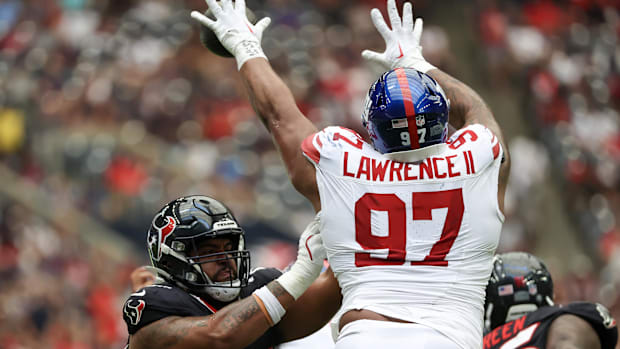 Houston Texans center Juice Scruggs (70) blocks New York Giants defensive tackle Dexter Lawrence II (97) as he blocks  quarte