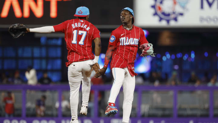 Jul 6, 2024; Miami, Florida, USA; Miami Marlins shortstop Vidal Brujan (17) and center fielder Jazz Chisholm Jr. (2) celebrate their win against the Chicago White Sox at loanDepot Park.