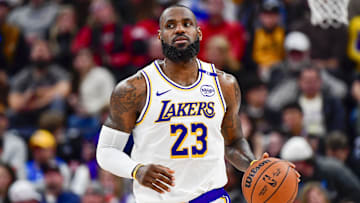 Dec 1, 2024; Salt Lake City, Utah, USA; Los Angeles Lakers forward LeBron James (23) dribbles the ball downcourt against the Utah Jazz during the second half at the Delta Center. Mandatory Credit: Christopher Creveling-Imagn Images