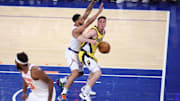 May 21, 2025; New York, New York, USA; Indiana Pacers guard T.J. McConnell (9) controls the ball against New York Knicks guard Cameron Payne (1) in the second quarter during game one of the eastern conference finals for the 2025 NBA Playoffs at Madison Square Garden. Mandatory Credit: Wendell Cruz-Imagn Images