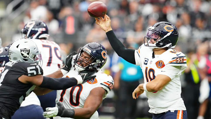 Caleb Williams stands in the pocket and delivers against the Raiders in a 25-24 victory.