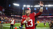 49ers quarterback Brock Purdy celebrates following a win over the Cardinals at State Farm Stadium. 