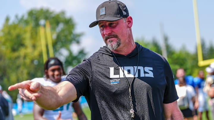 Detroit Lions head coach Dan Campbell talks to staff at the end of the joint practice with the Miami Dolphins at the Lions headquarters and training facility in Allen Park, Thursday, Aug. 14, 2025.