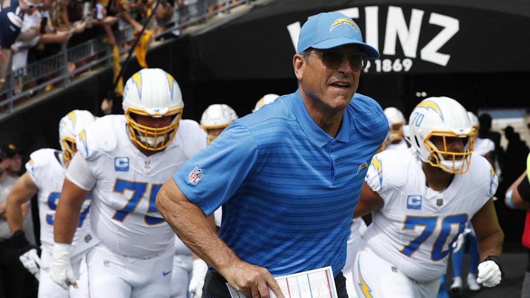 Sep 22, 2024; Pittsburgh, Pennsylvania, USA;  Los Angeles Chargers head coach Jim Harbaugh leads his team onto the field to play the Pittsburgh Steelers at Acrisure Stadium. Mandatory Credit: Charles LeClaire-Imagn Images